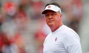 After using'shameful' language in a film session, Oklahoma assistant football coach Cale Gundy resigns from his position.